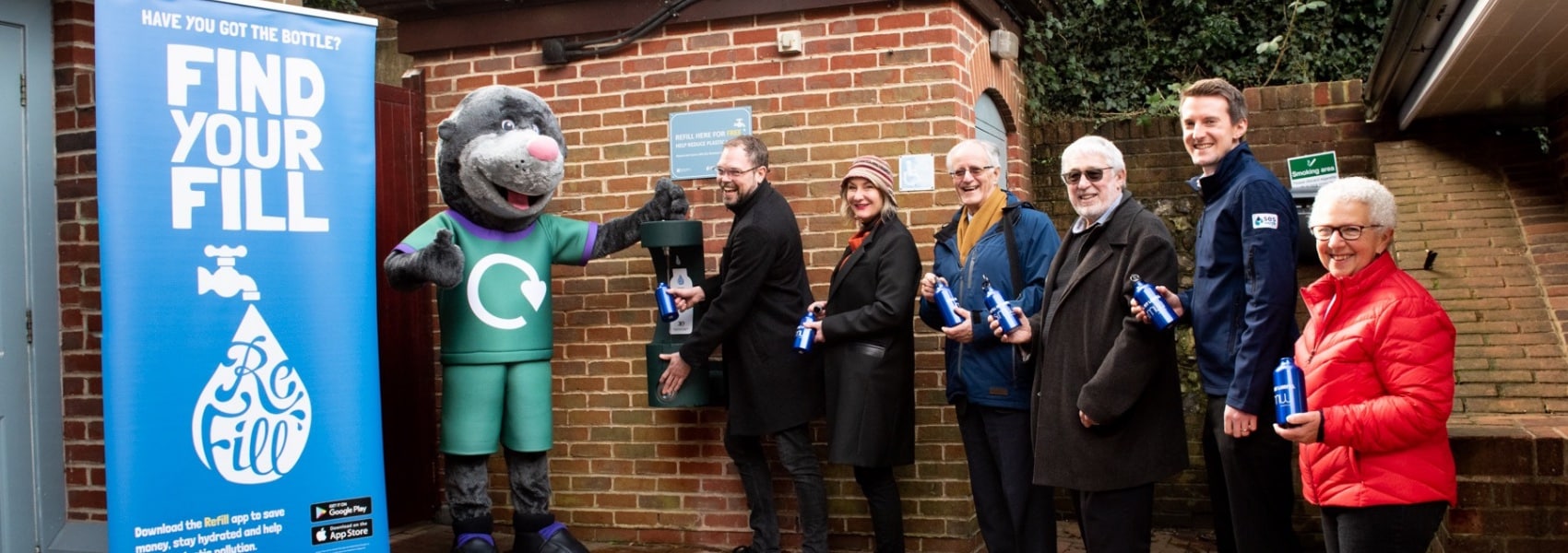 A queue of happy people ready to refill their water bottles