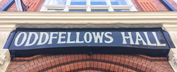 Community members participating in group activity at Oddfellows Hall in Dorking
