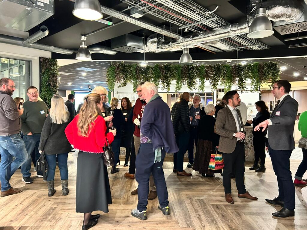 Business networking event at Kuoni offices in Dorking with attendees socialising