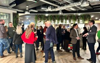 Business networking event at Kuoni offices in Dorking with attendees socialising