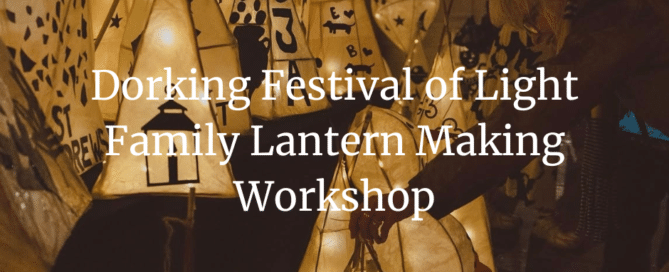 Collection of illuminated handmade wooden lanterns with decorative patterns including stars and nature designs