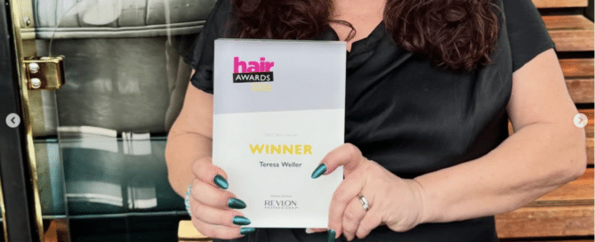 Teresa Weller holding Hair Magazine Awards winner certificate at salon