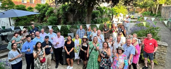 BID members gathering in Downs Solicitors heritage garden for a summer social event in Dorking