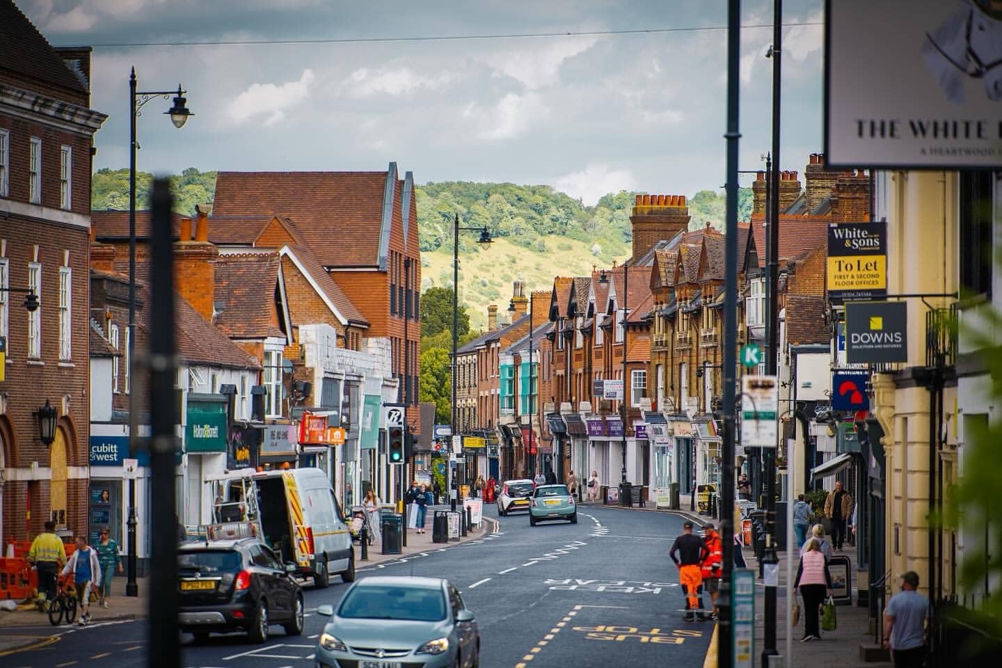 People enjoying weekend events in Dorking town centre in Surrey
