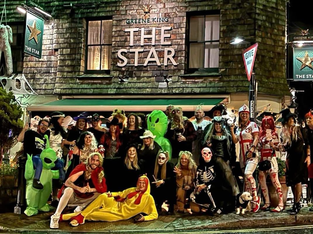 Halloween fancy dress group outside The Star pub in Dorking, Surrey
